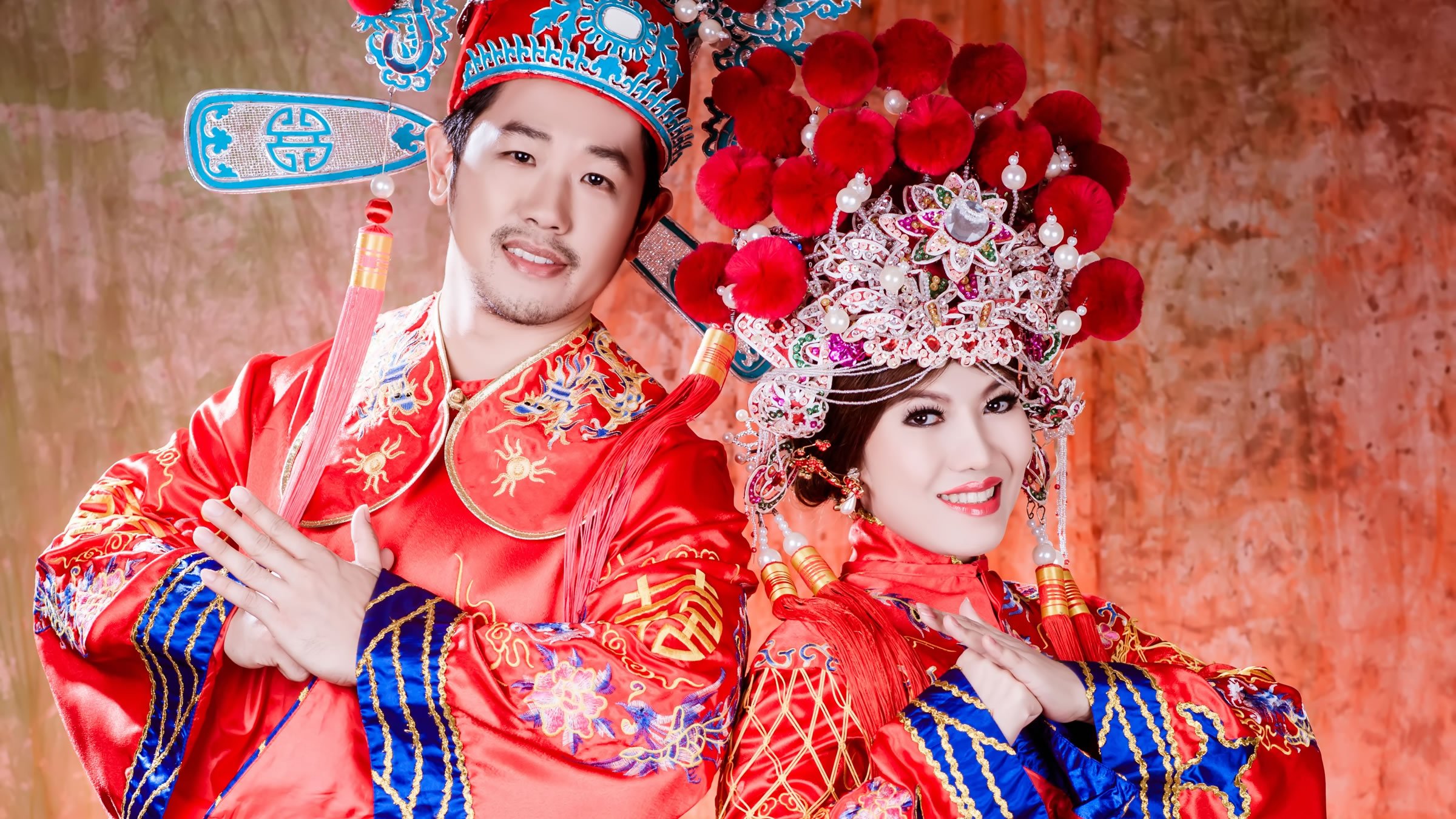 Chinese wedding with typical attire of the bride and groom